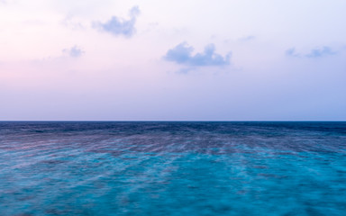 Fototapeta premium Ocean at sunset. Colorful sunset over the Indian Ocean. Long exposure.