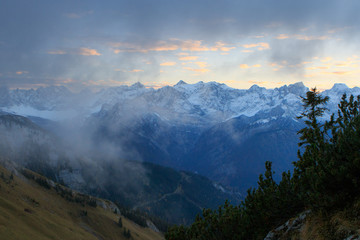 Sunset above clouds in the mountains