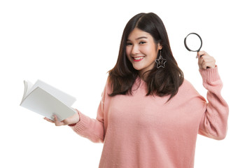 Asian woman with a book and magnifying glass.