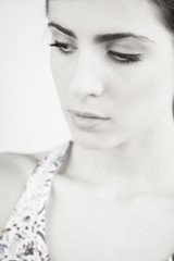 Portrait of serious gorgeous woman thinking isolated black and white