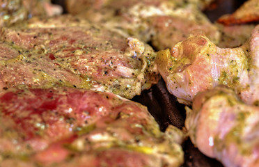 Baking fresh meat on grill closeup