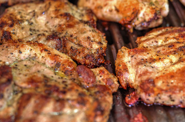 Baking fresh meat on grill closeup