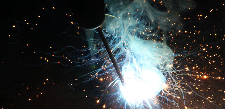 Sparks and jets of smoke when welding