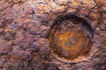 The surface of the broken metal rusts naturally.