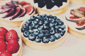 Closeuo of blueberry tart dessert tray assorted