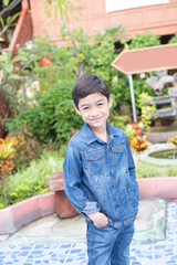 Fototapeta premium Portrait of little boy wearing jeans fashion