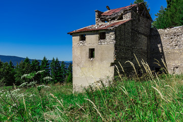 Green Fields Blue Sky And An Old Stone House