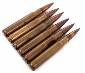 six military cartridges isolated on  white background