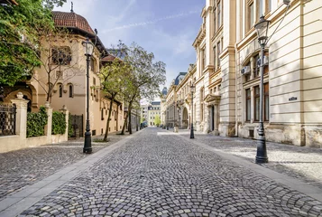  The beautiful Strada Postei street in the Lipscani district, in a moment of tranquility without people, historical center of Bucharest, Romania © Marco Taliani