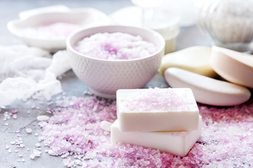 Spa composition with pink sea salt and variety of natural soap 