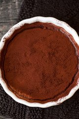 Chocolate souffle with walnuts and cocoa powder