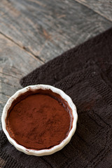 Chocolate souffle with walnuts and cocoa powder