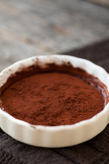 Chocolate souffle with walnuts and cocoa powder