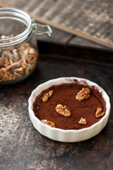 Chocolate souffle with walnuts and cocoa powder