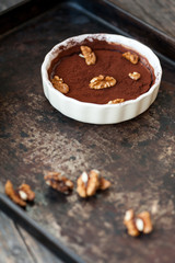 Chocolate souffle with walnuts and cocoa powder