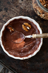 Chocolate souffle with walnuts and cocoa powder