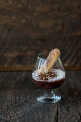 Chocolate souffle with coconut flakes in a glass