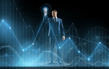 businessman in suit touching virtual graph