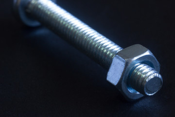 Close-up isolated bolt on black background