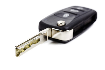 Opened ignition key with immobilizer on a white background