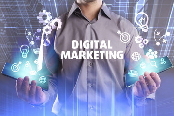 Business, Technology, Internet and network concept. Young businessman working on a virtual screen of the future and sees the inscription: Digital Marketing