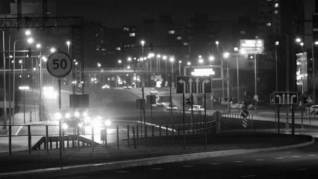 Time Lapse of Street Traffic at Night in Vilnius, Lithuania. Black and white.