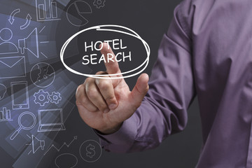 Business, Technology, Internet and network concept. Young businessman shows the word: Hotel search
