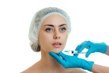 cute girl without makeup in the medical cap on his head at a reception at the doctor