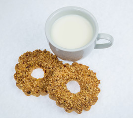 white Cup of milk with cookies on a white background