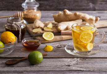  Ginger tea and ingredients on a  grunge wooden background
