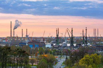 Obraz na płótnie Canvas Cranes of the shipyard in Gdansk at sunset, Poland