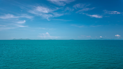 Fototapeta na wymiar Serene turquoise sea and cloud blue sky view background