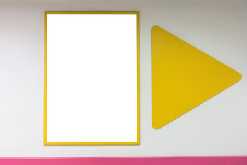 Mock up blank poster frame with yellow frames hanging on wall in shopping mill