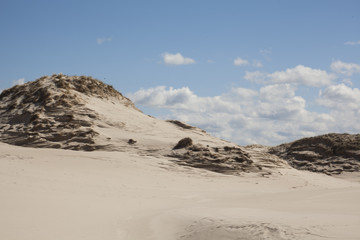 Fototapeta na wymiar Sand, dunes and blue sky