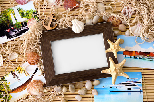 Travel concept. Composition with photo frame on bamboo mat background