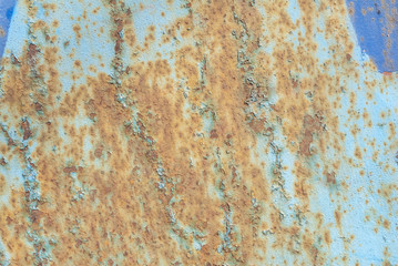 surface of rusty iron with remnants of old paint, grunge metal surface, texture background