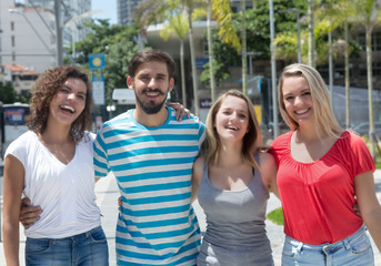 Group of caucasian and hispanic woman with latin man