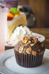fruit cake muffin dessert and sweet beverage in cafe