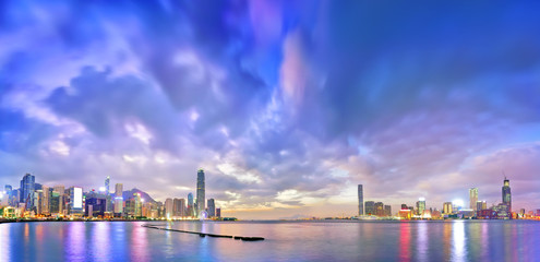 Fototapeta na wymiar Victoria Harbor and Hong Kong skyline at dusk.
