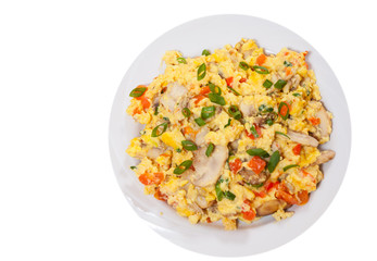 scrambled eggs with mushrooms and vegetables. top view. isolated on white