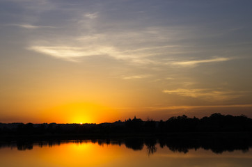 Fototapeta na wymiar Colorful sunset over the pond
