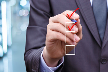 Businessman Hand Checking the Checking Box .