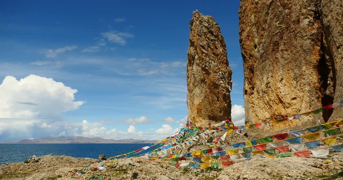 4k Prayer flags at the lake namtso in tibet,ancient holy monk meditation in cave,ZhaXi Peninsula,tibet mansarovar,Tibet's second largest lake,is the third largest saltwater lake in China.