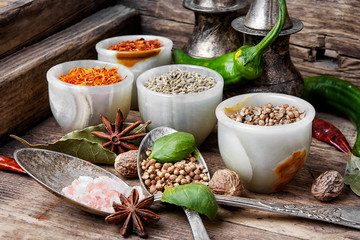 peppercorn and Indian spice.Variety of spices and seasonings on kitchen table