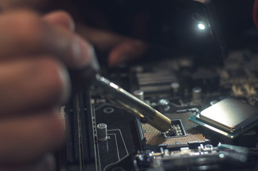  Computer processor. Technician works with CPU socket.