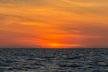 Naklejka na ściany i meble Colorful sunset over the sea