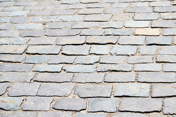  Granite cobblestoned pavement background. Abstract background of old cobblestone pavement close-up. Seamless texture. 