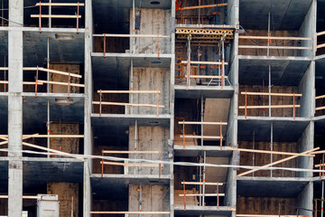 close-up of the construction of a house made of cast-in-place concrete and panels. Construction of walls of foam blocks of bricks. Concept skeleton erection of multi-storey apartments.