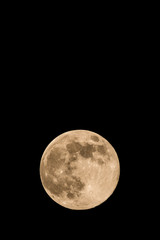 Nice full-moon with soft yellow color an visible craters