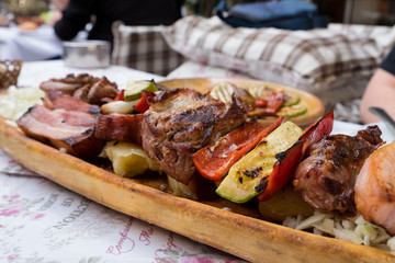 Serbian specialities known as rostilj include grilled pork neck, beef steak and vegetables 